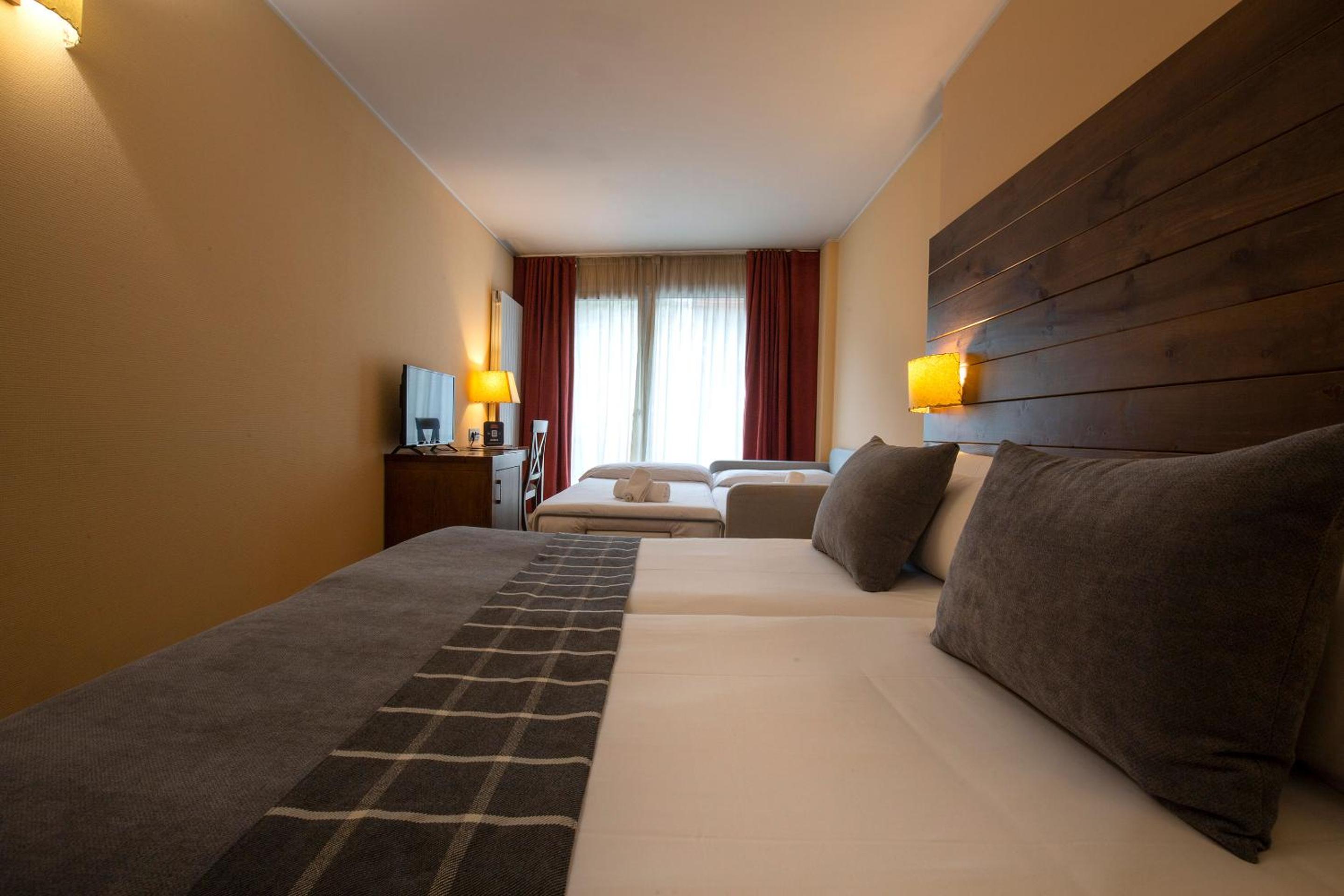 Quadruple Room (2 Adults + 2 Children)