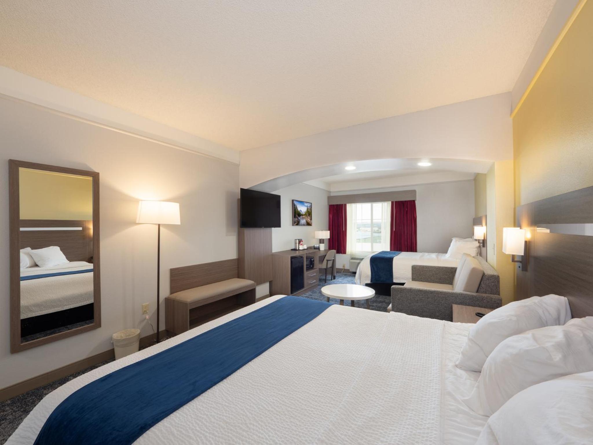 Larger Room with One King and One Queen Bed and Sofa - Non-Smoking