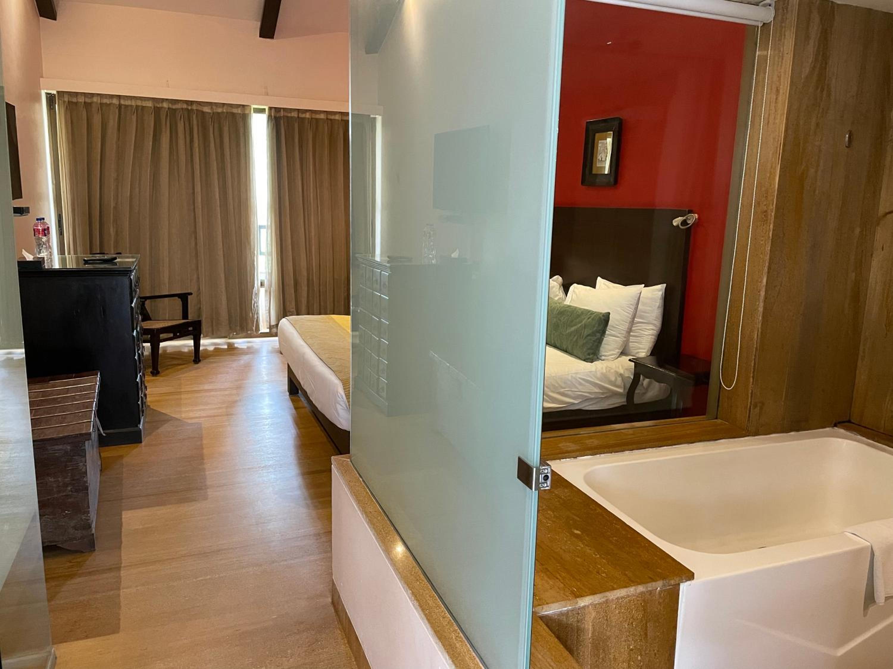 Deluxe Room twin bed with balcony and bathtub