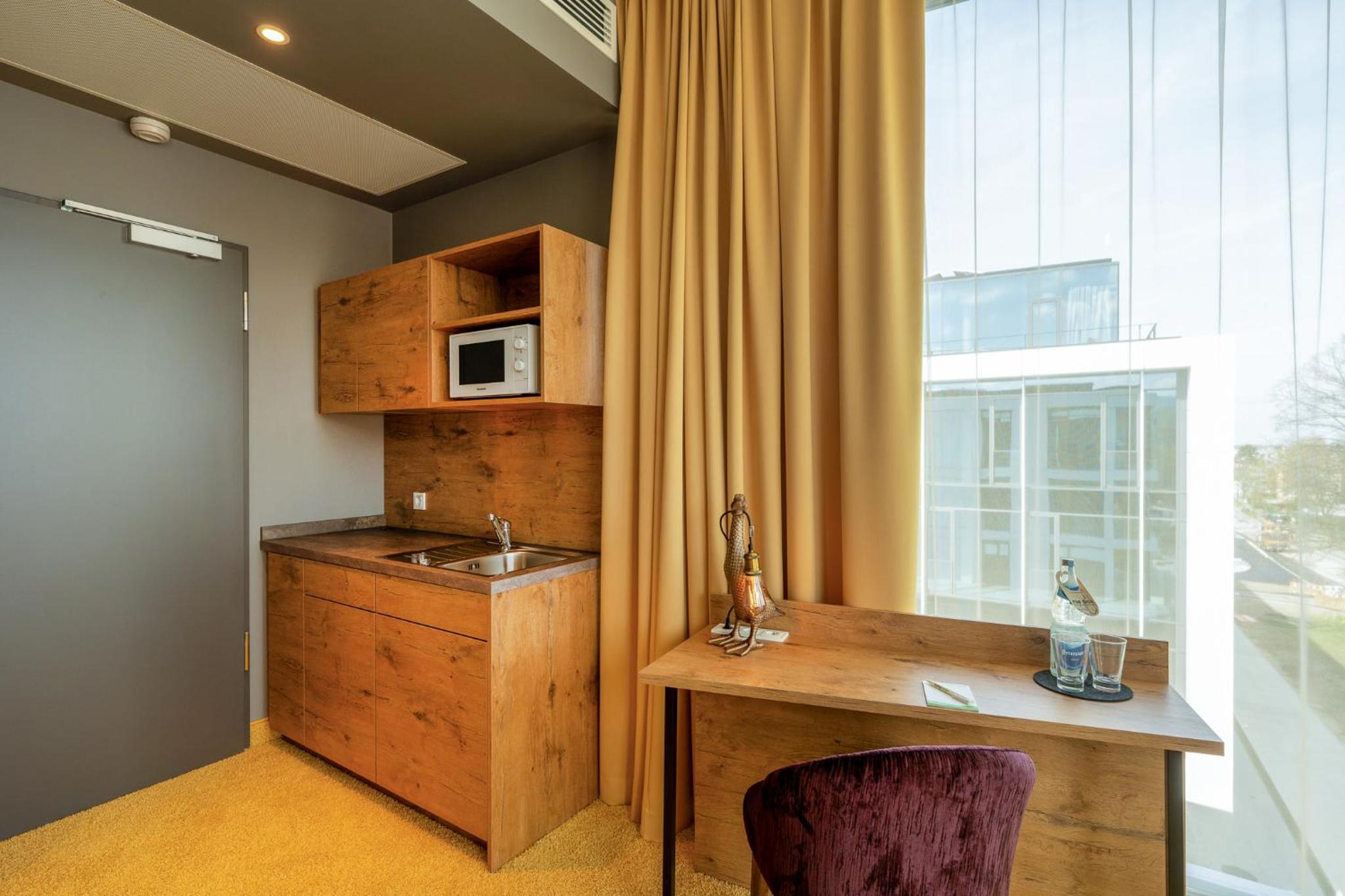 Doppelzimmer „TASTY“ mit Küchenzeile