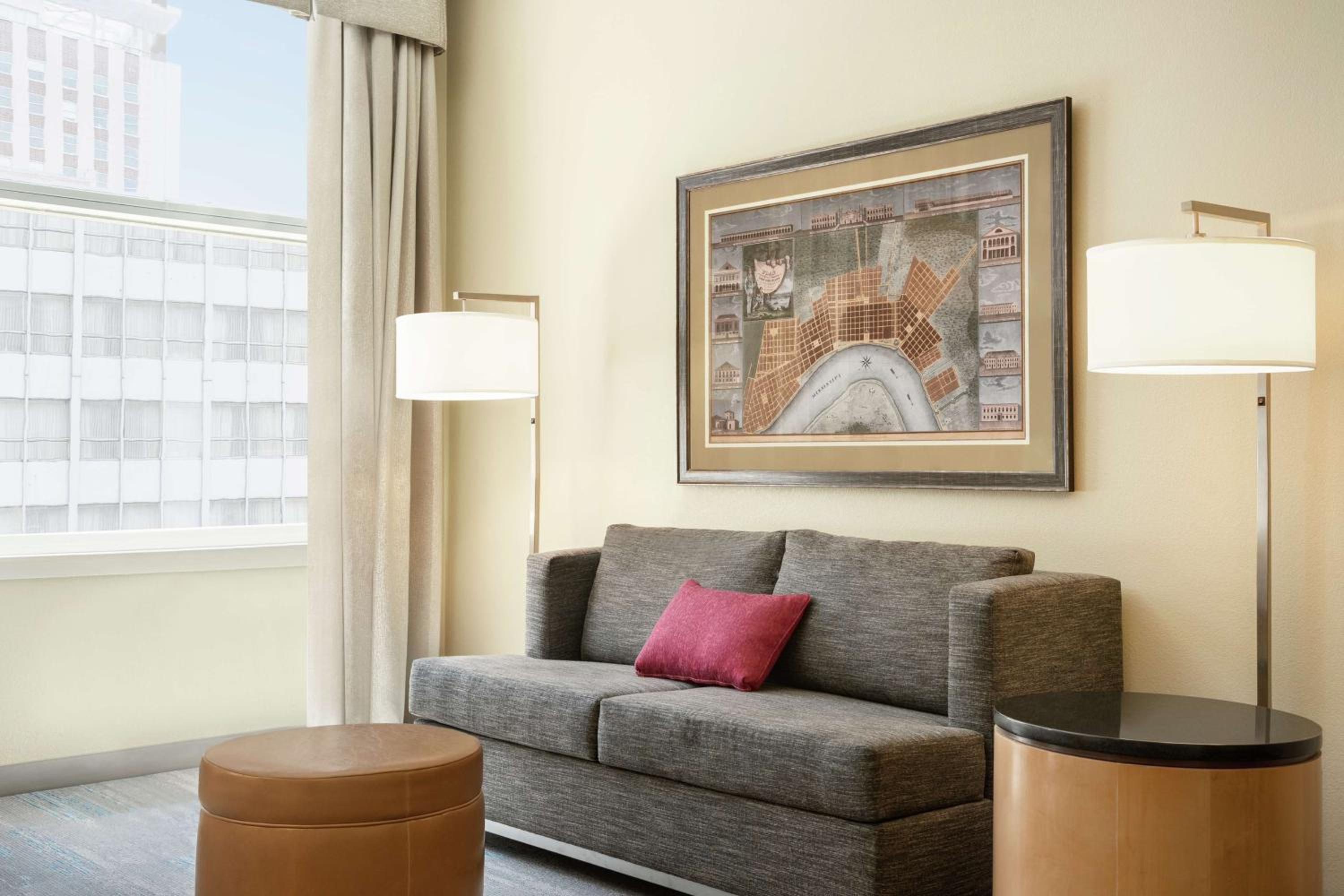 Corner Queen Room with Two Queen Beds and Sofa Bed