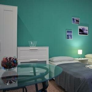 Четырехместный номер Комфорт с четырьмя односпальными кроватями (Comfort-extra)