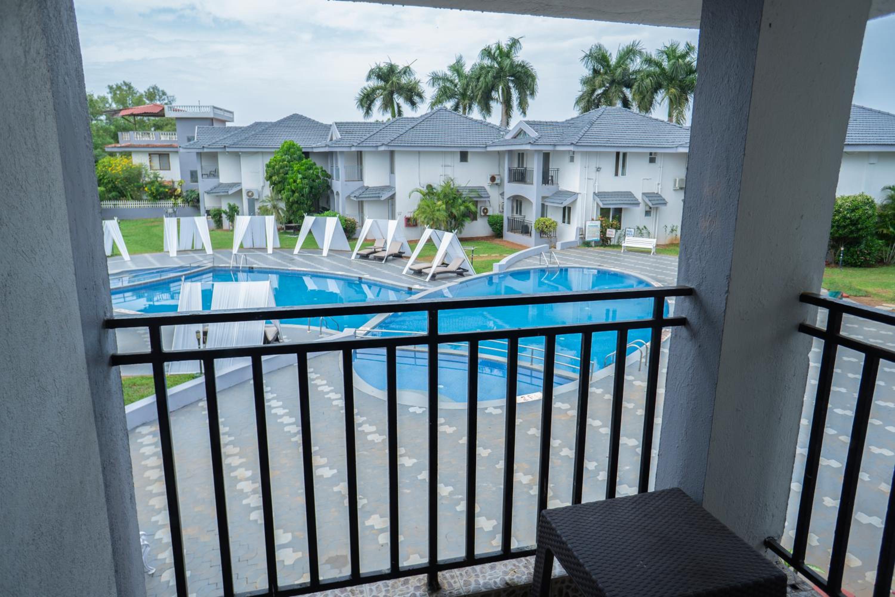 Luxury  Pool View Suite with living room & balcony	