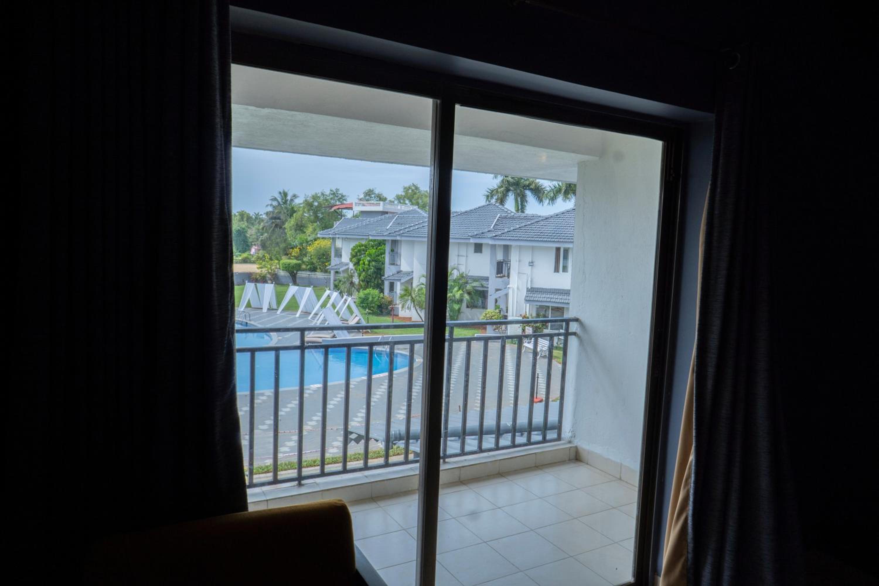 Deluxe pool view room with balcony	