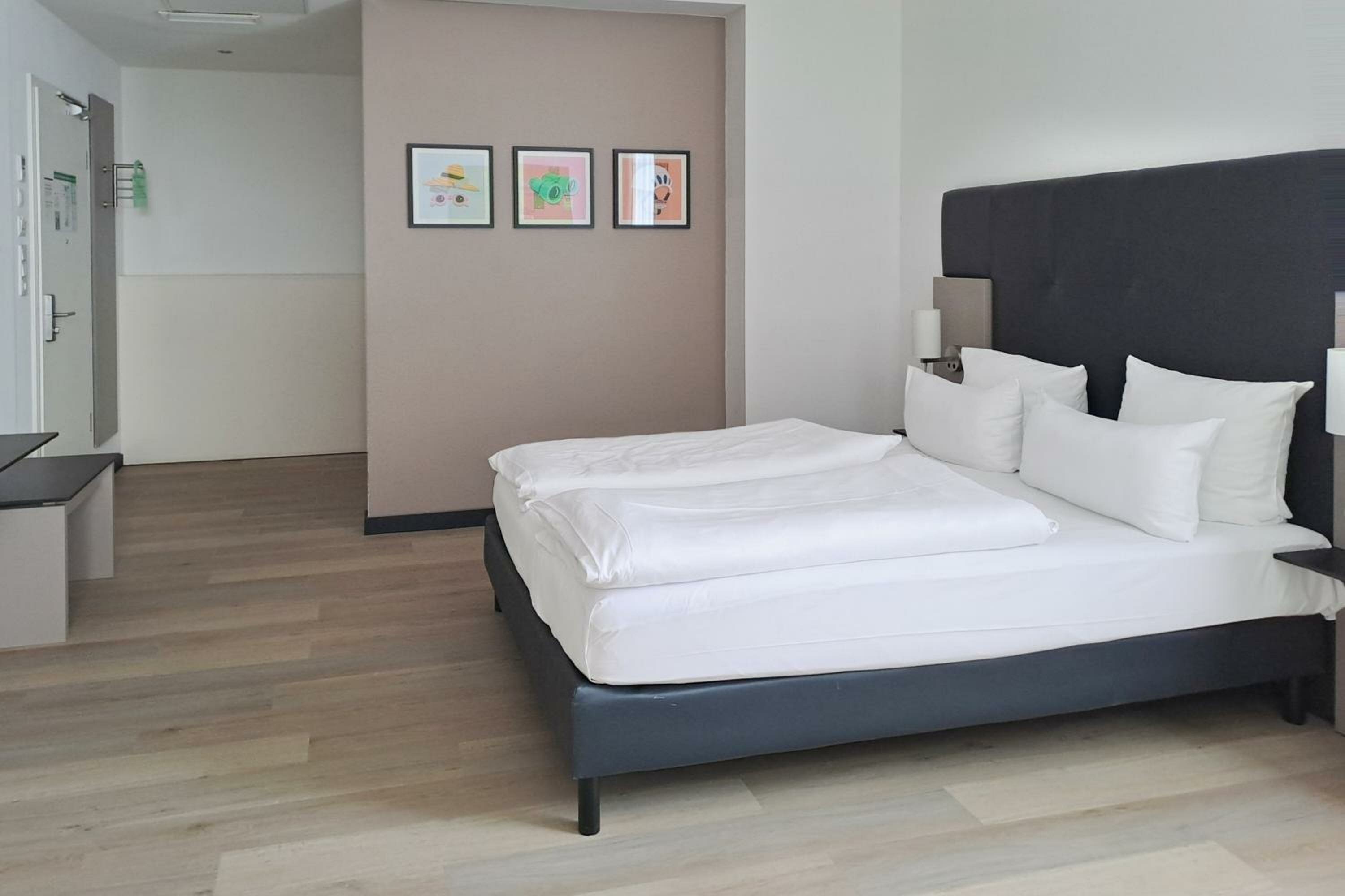 Premium Family Room with Two Queen Beds and Single Sofa Bed