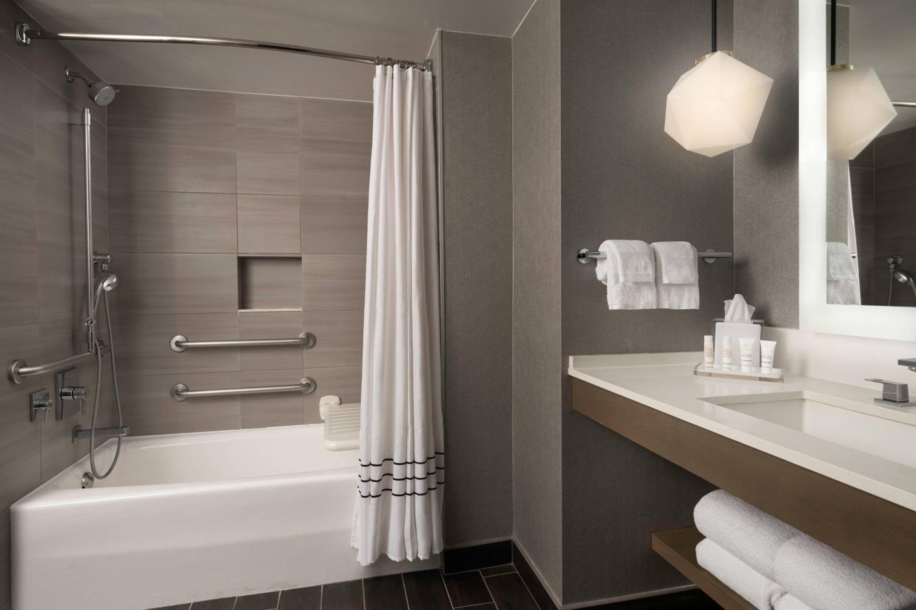 Ideal King Room with Balcony - Mobility Accessible with Roll-In Shower