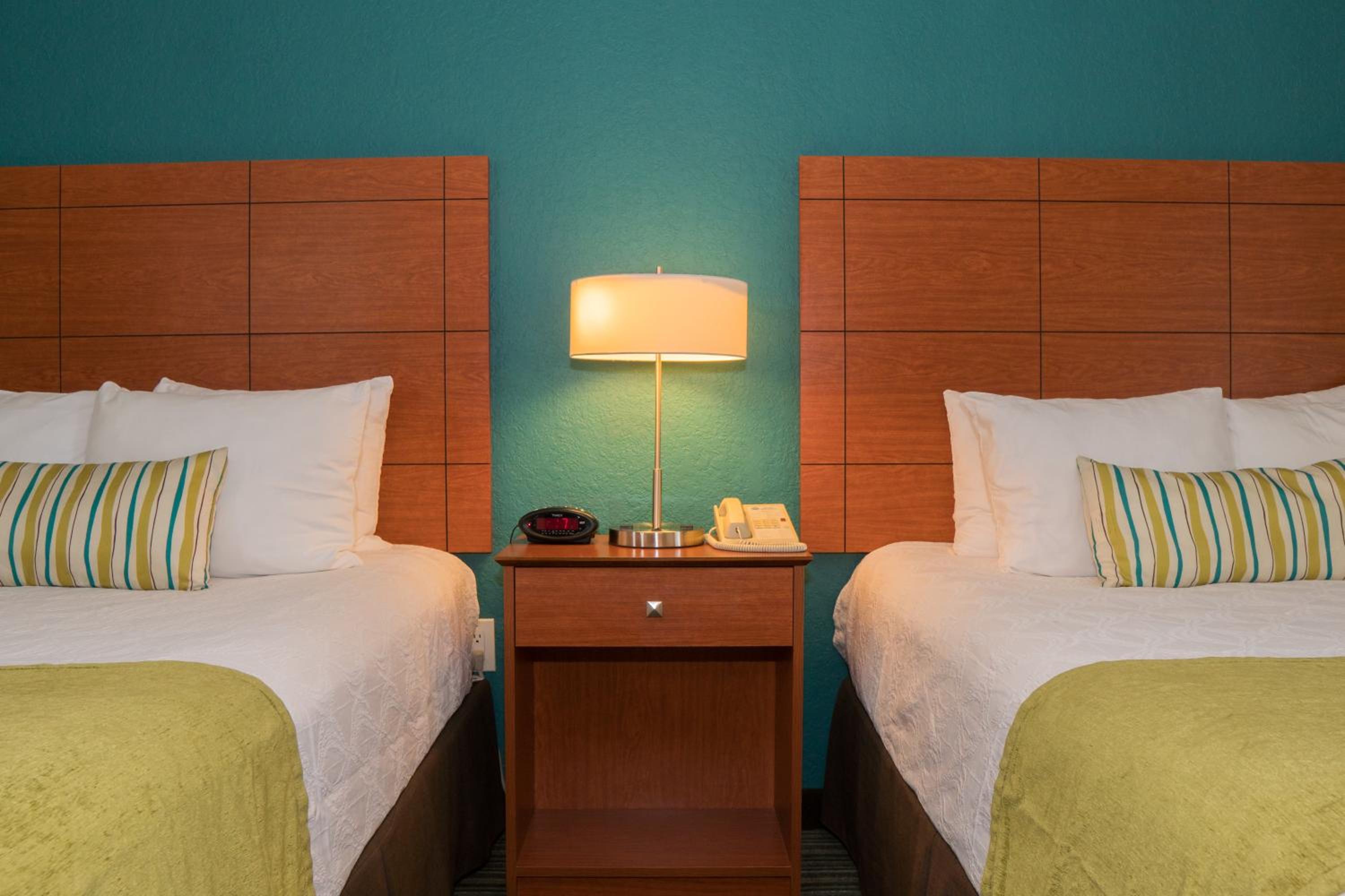 Quadruple Room with Queen Bed and Balcony - Non-Smoking