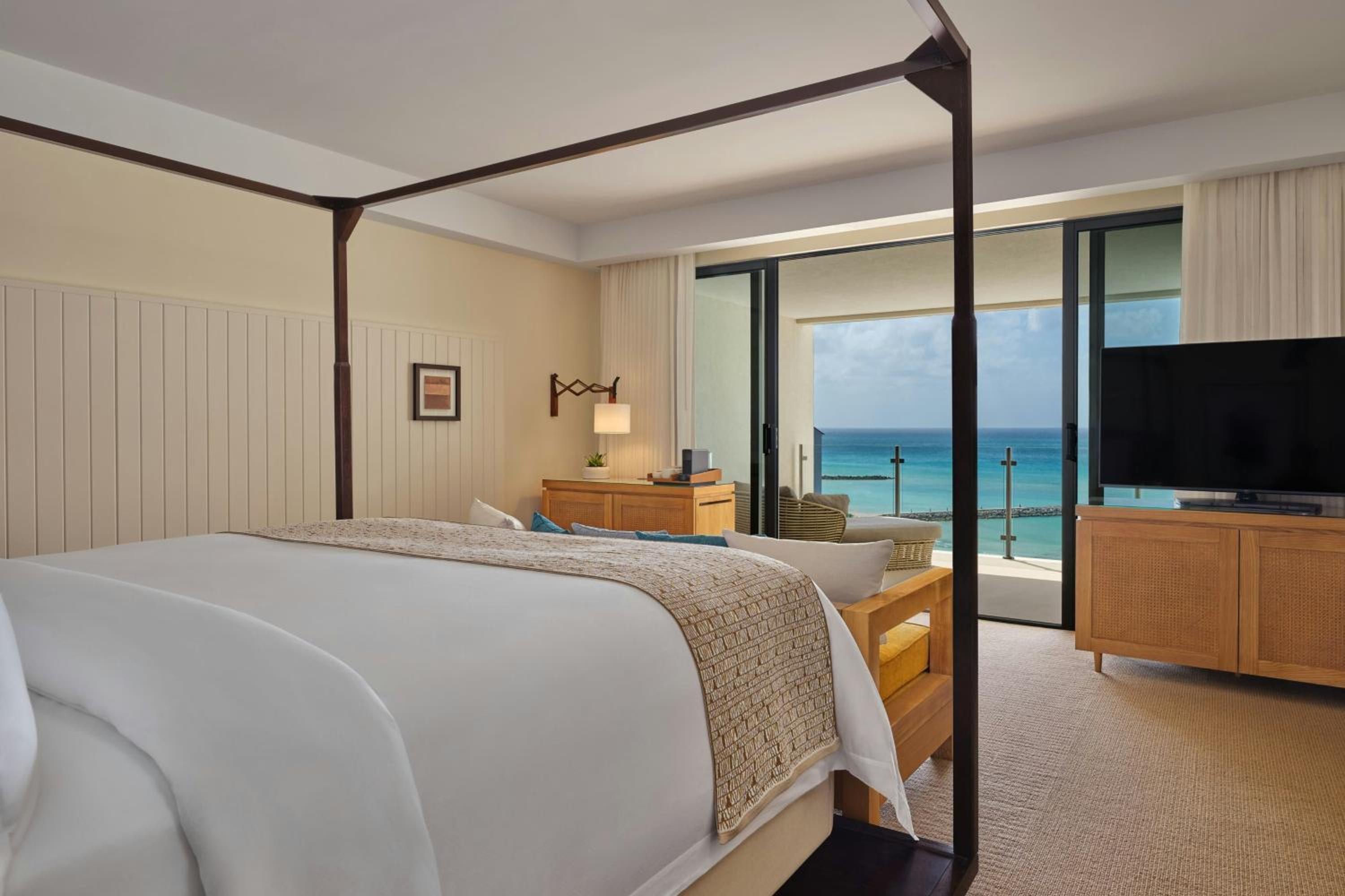 Deluxe King Room with Balcony and Partial Ocean View