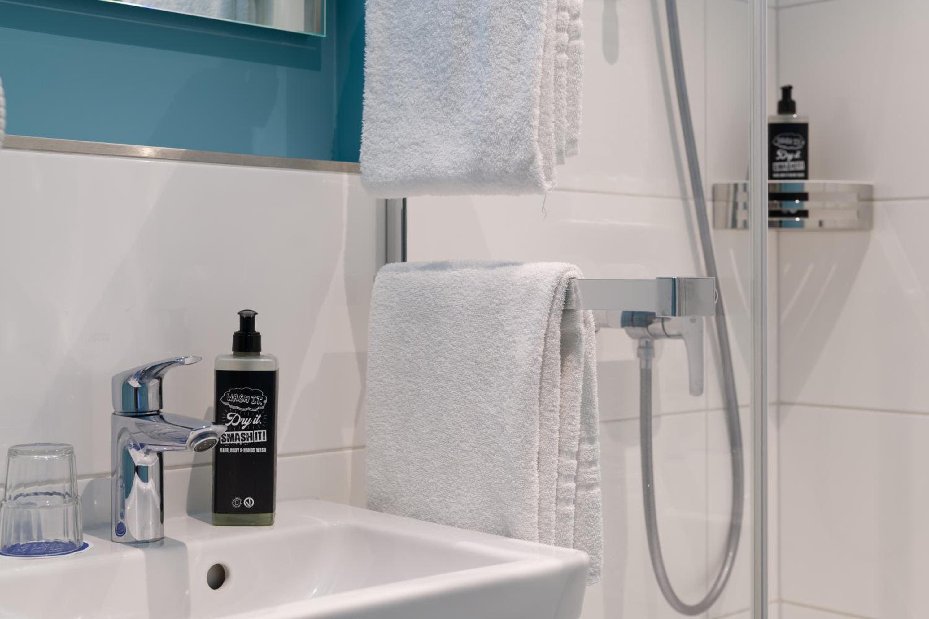 Small twin room with private bathroom and toilet