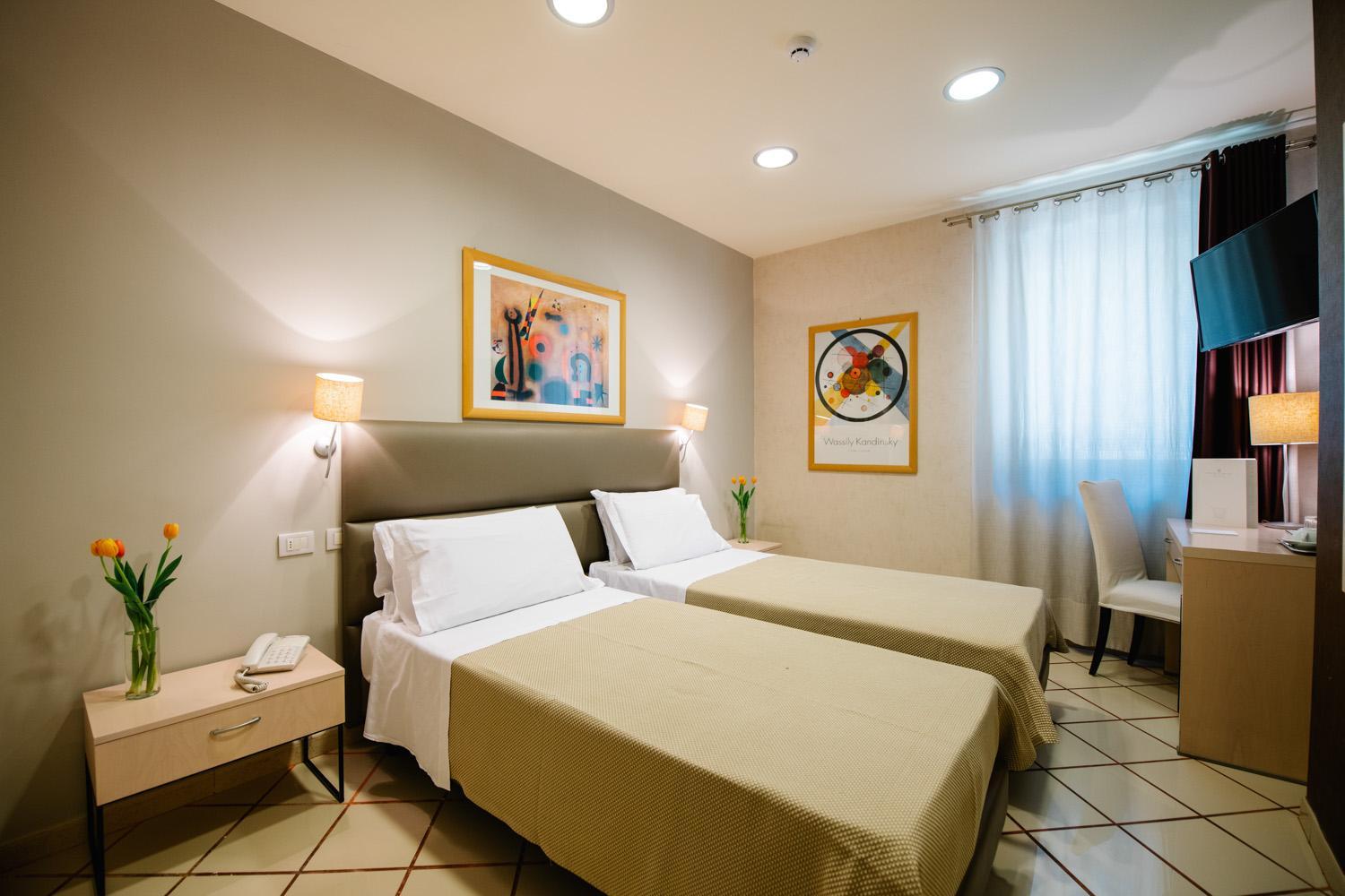 Deluxe Room with One Queen and Two Single Beds - Non-Smoking
