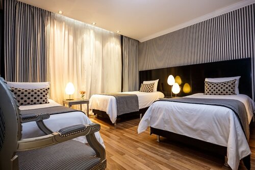 Стандартный трехместный номер в Unique Executive Central