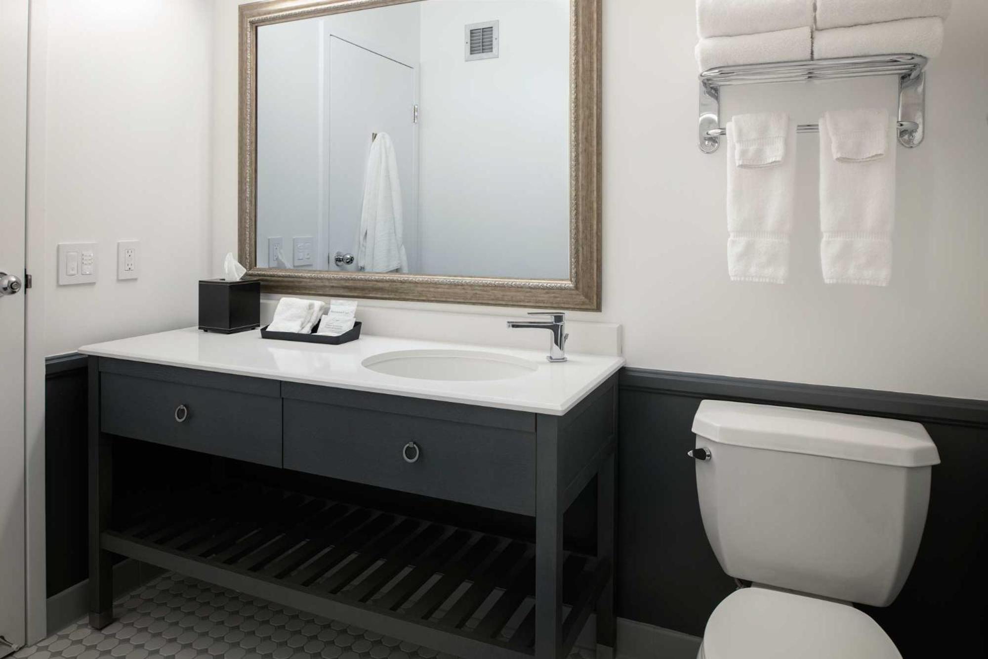 Two Queen Beds With A Loveseat Room