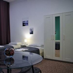 Четырехместный номер Комфорт с четырьмя односпальными кроватями (Comfort-extra)