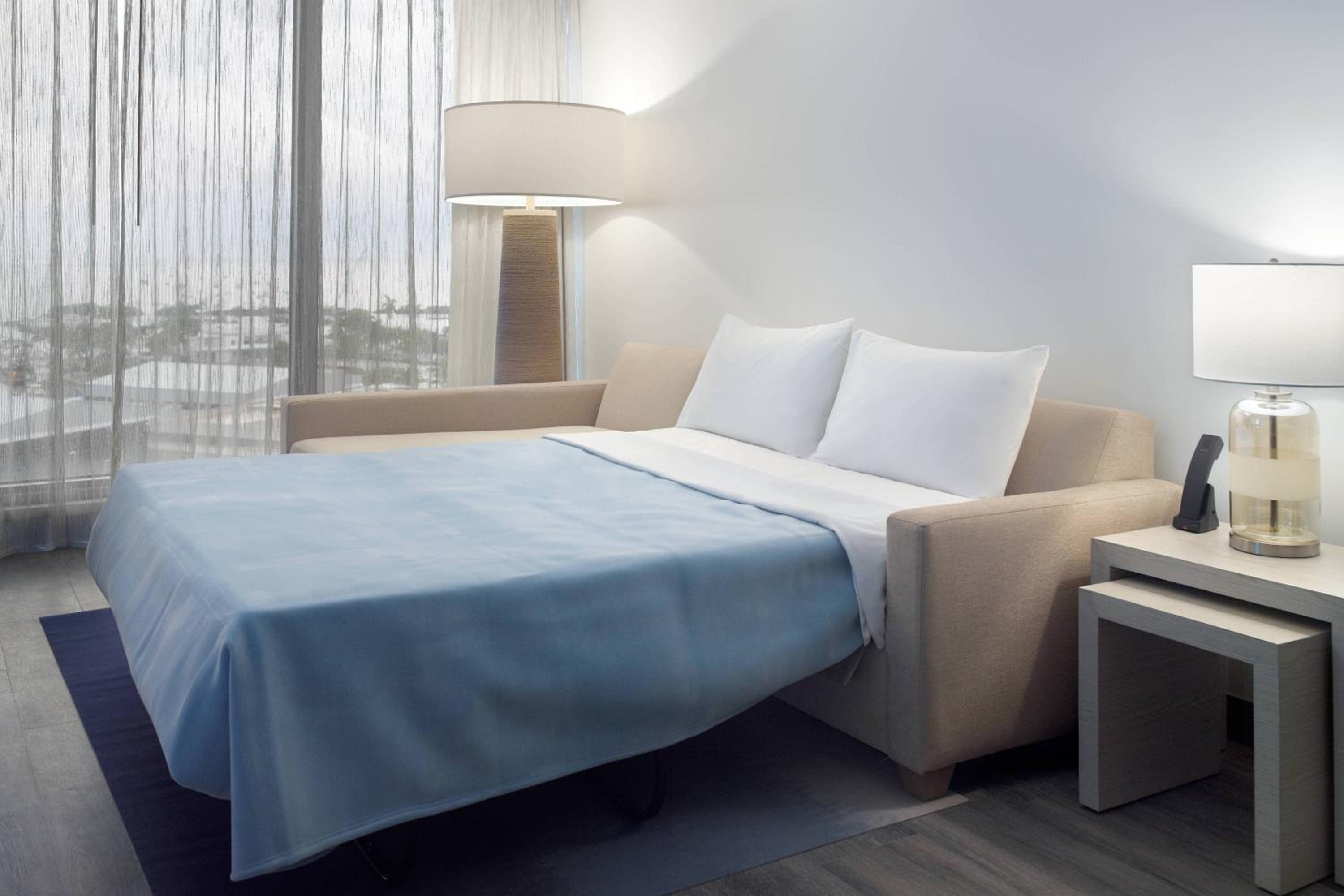 One-Bedroom King Suite with Sofa Bed and Partial City View - Hearing Accessible