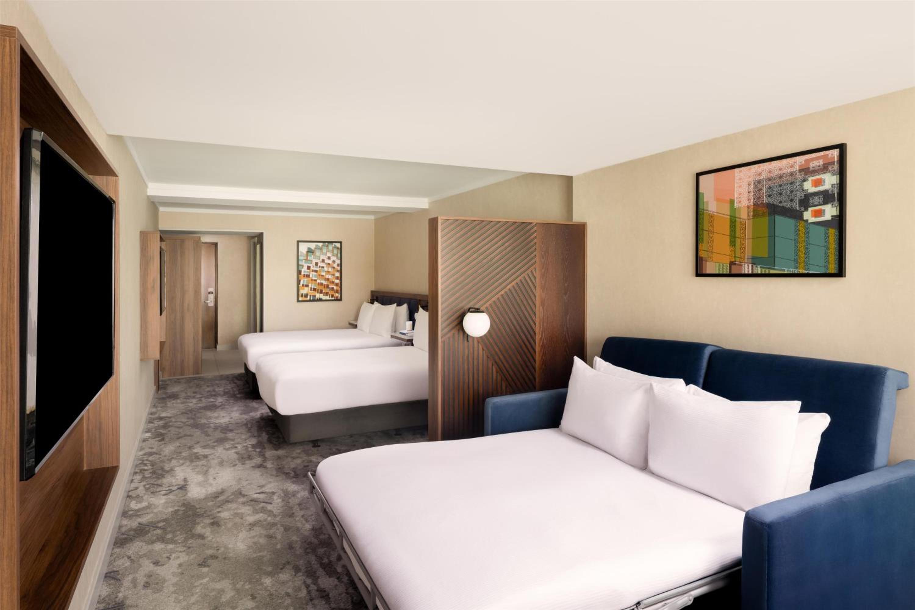 Premium Room with Two Queen Beds and Sofa Bed