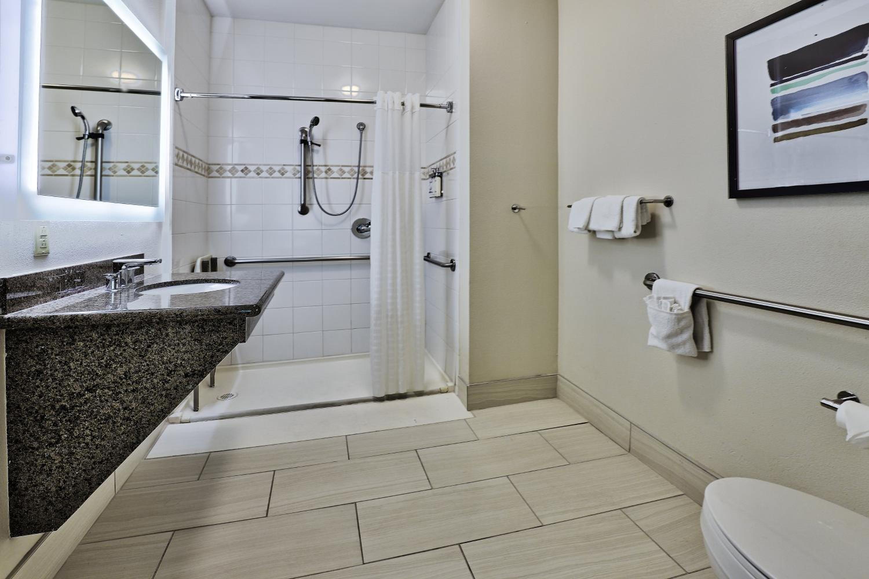 Queen Studio Suite with Roll In Shower - Mobility Accessible