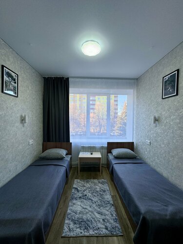 Двухместный номер с 2 отдельными кроватями и общим туалетом