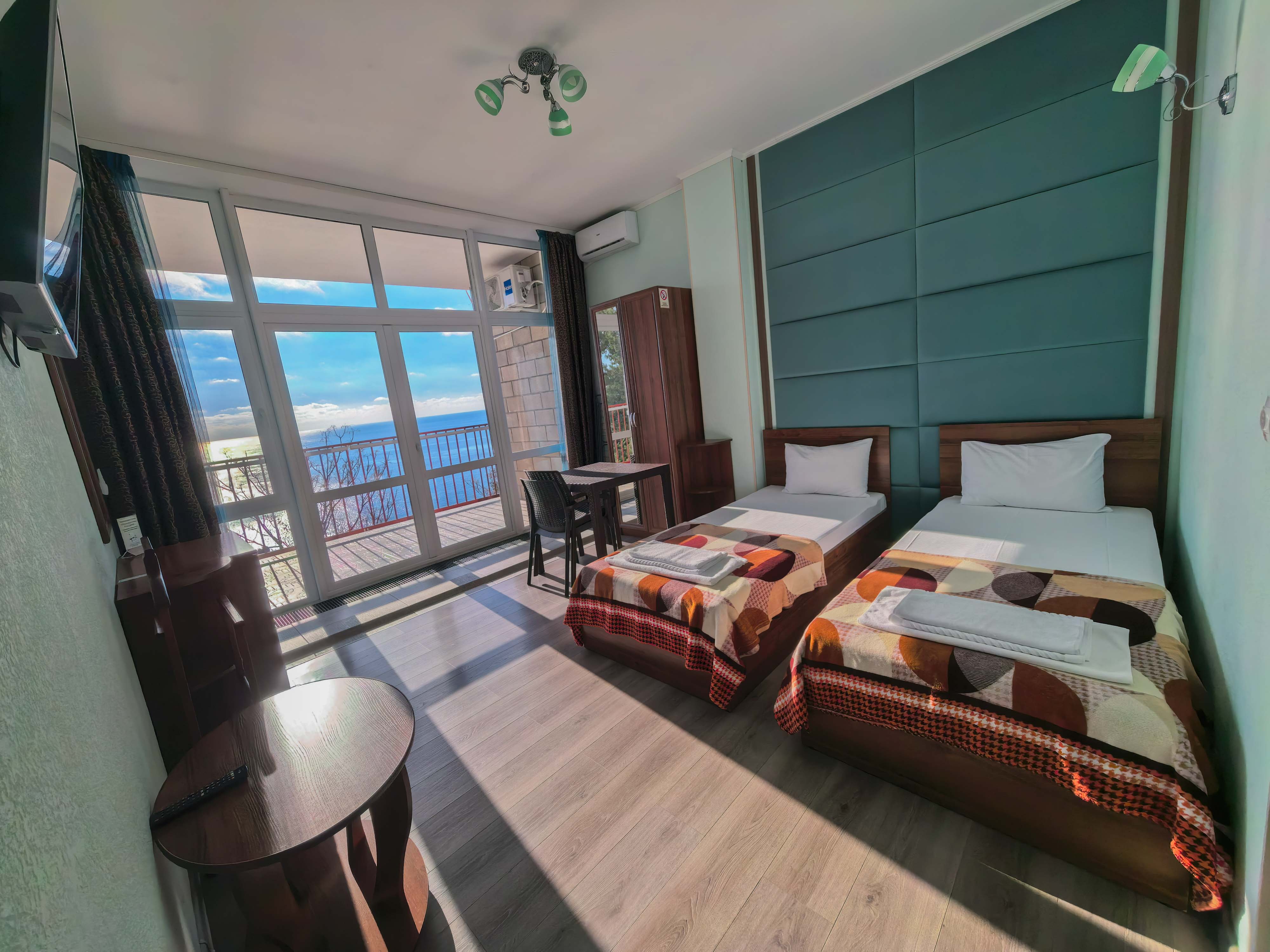 Двухместный однокомнатный люкс с кухней и видом на море