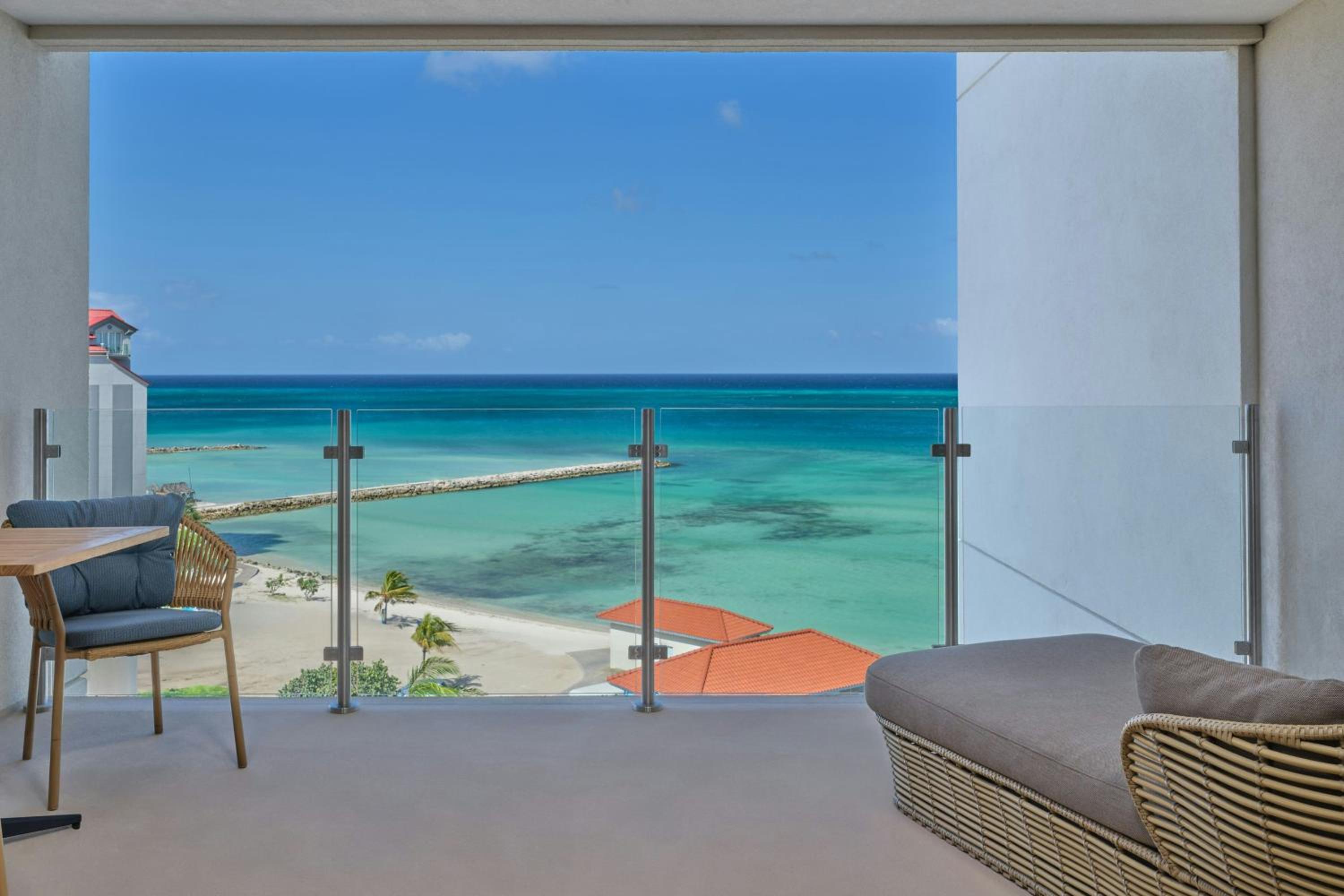 Deluxe King Room with Balcony and Partial Ocean View
