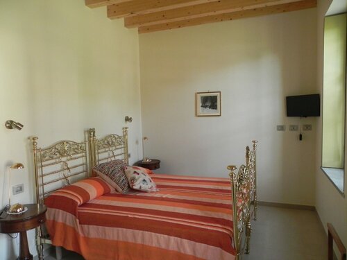 Номер для новобрачных, первый этаж (Brass Bedroom) в Agriturismo Cascina Poscallone