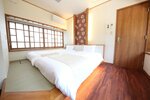 Номер с 2 односпальными кроватями, вид на сад в Ichinomatsu Japanese Modern Hotel