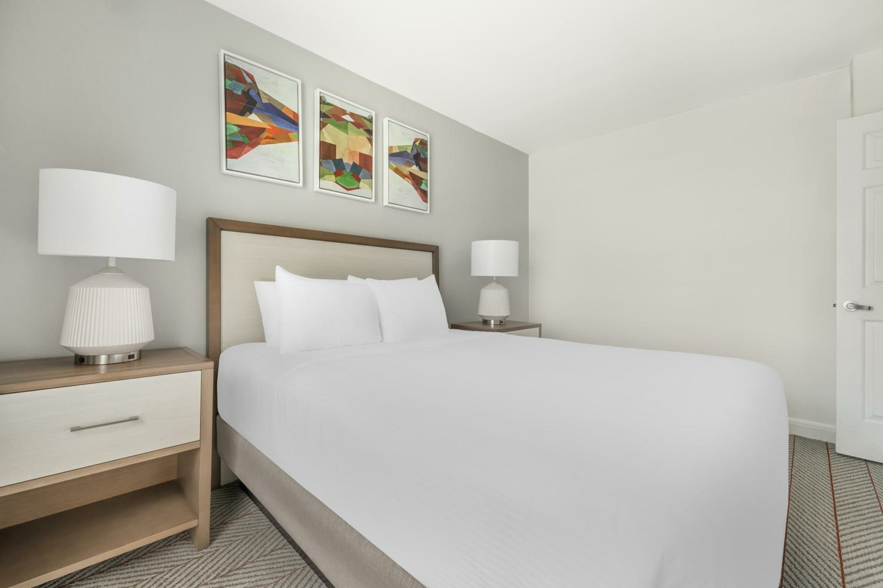 Two-Bedroom Suite with One King Bed, One Queen Bed, and Roll-In Shower