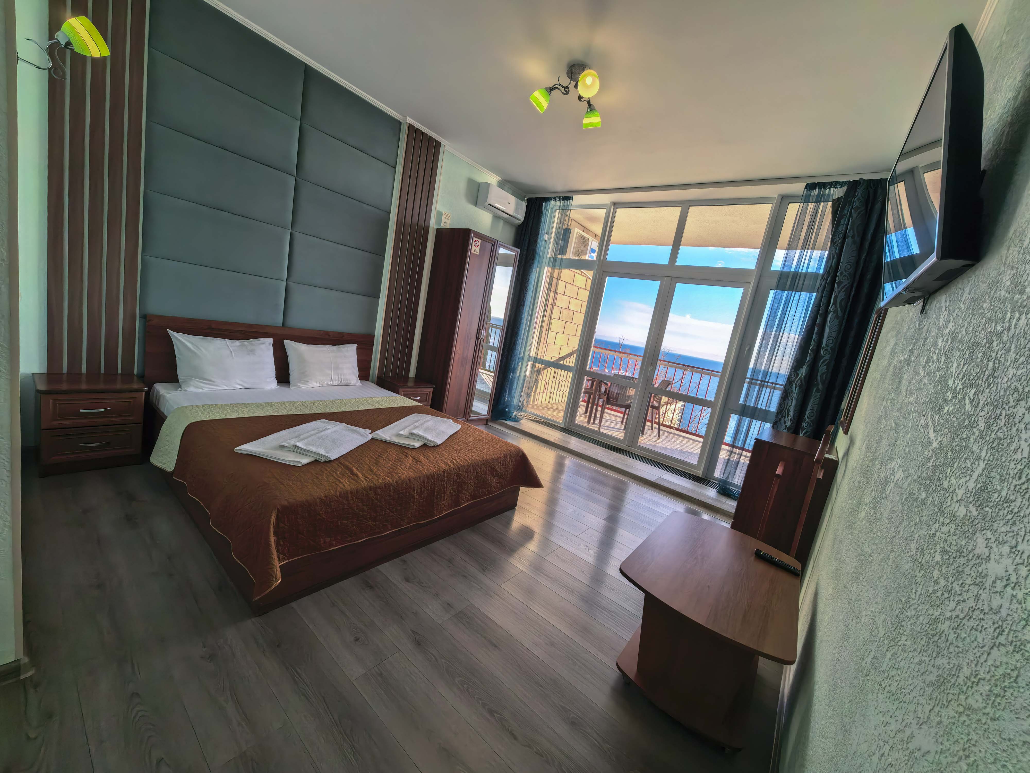 Двухместный однокомнатный люкс с кухней и видом на море