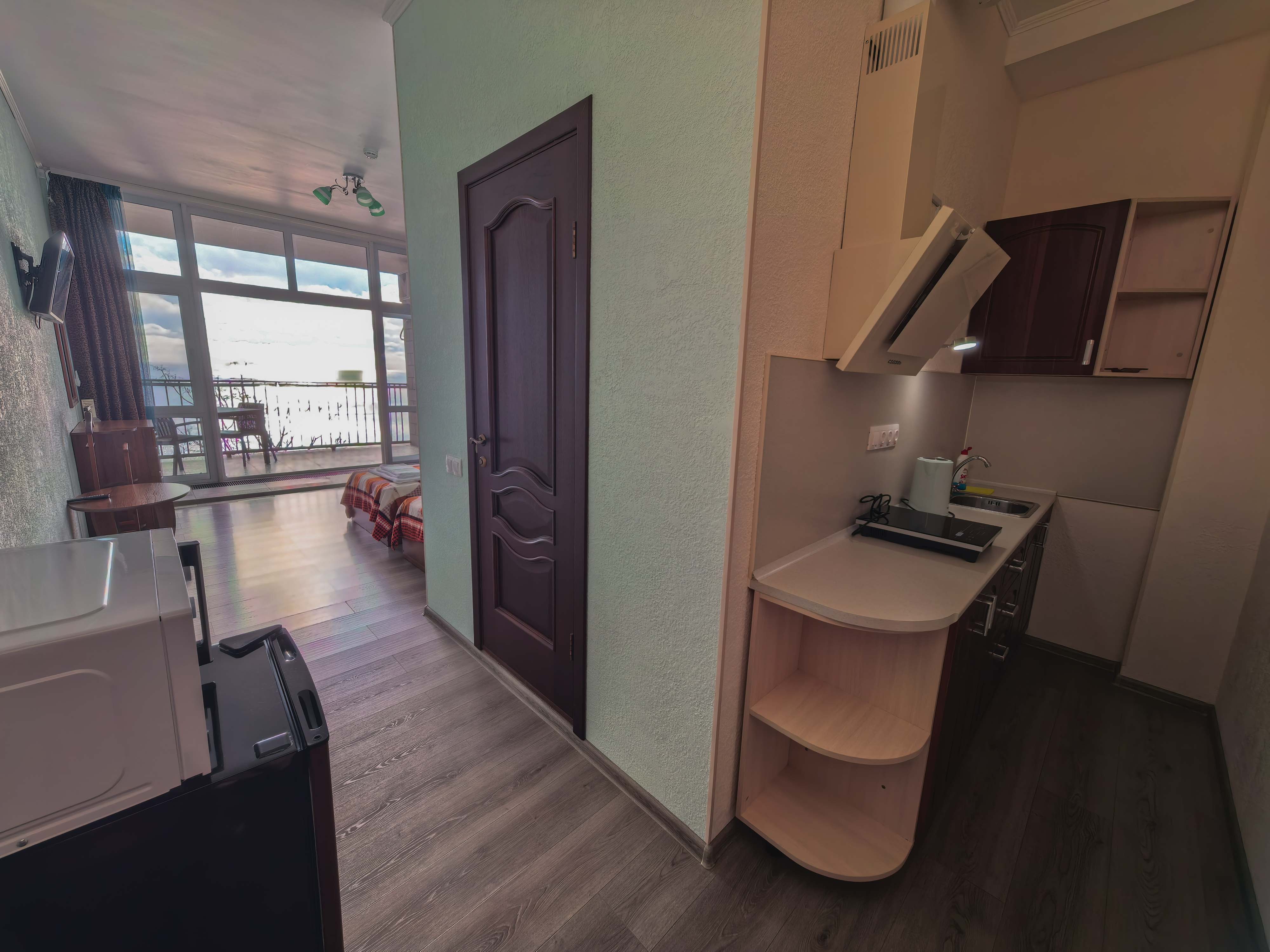 Двухместный однокомнатный люкс с кухней и видом на море