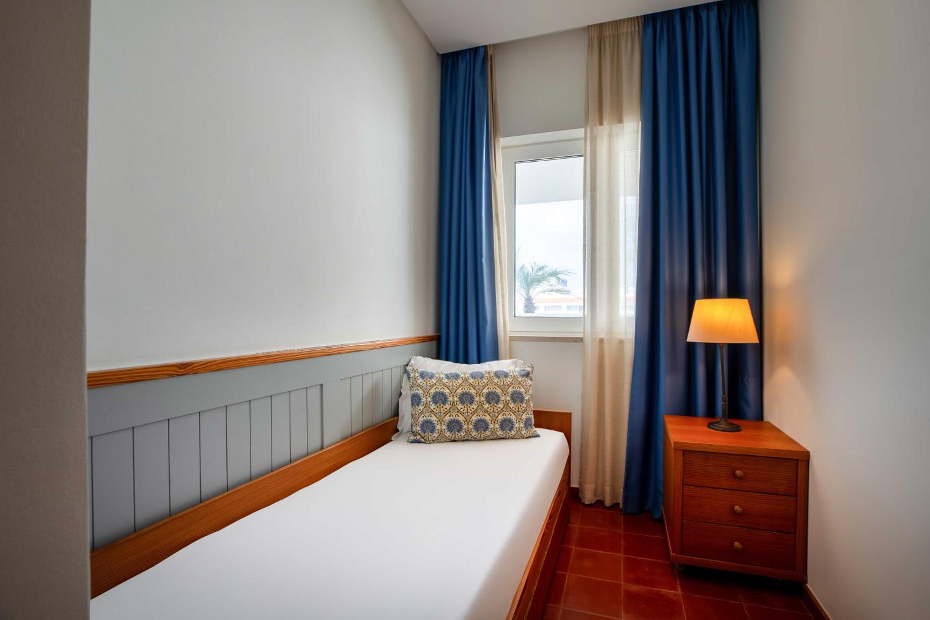 Three-Bedroom Apartment with Balcony and Pool View