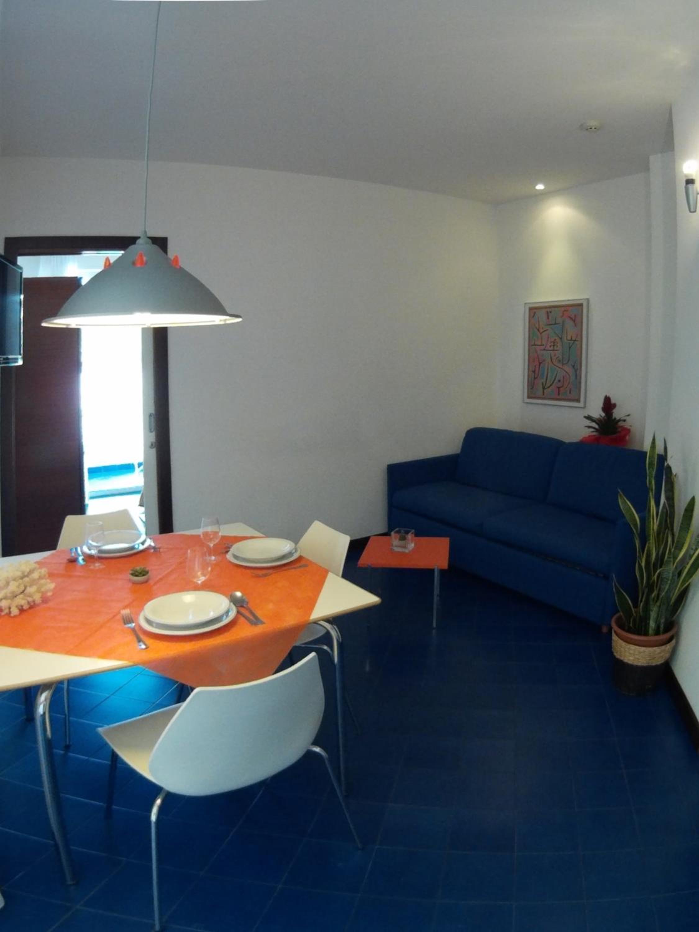 One-Bedroom Apartment with Balcony and Lateral Sea View