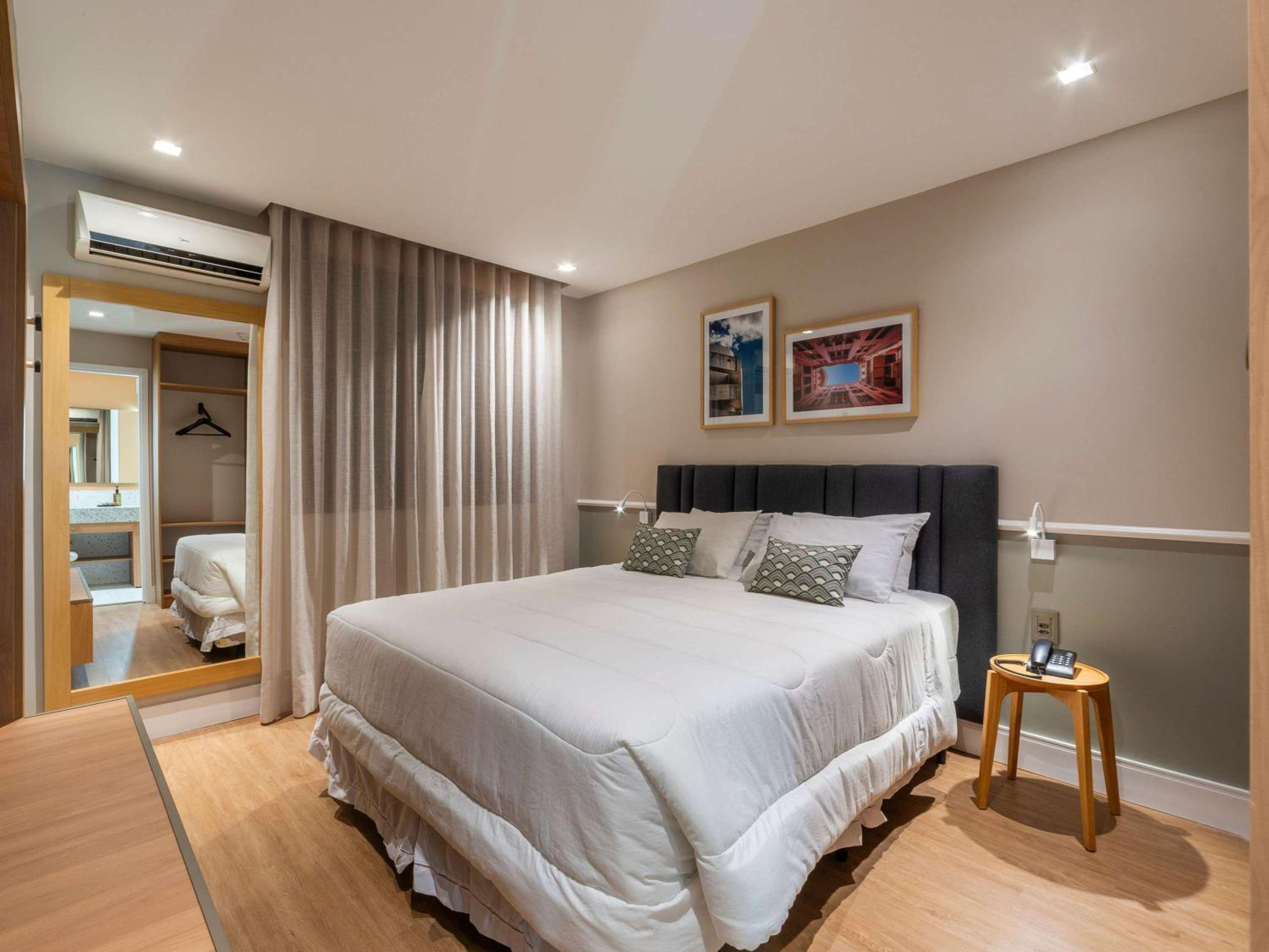 Executive Room with a Queen Bed and a Sofa