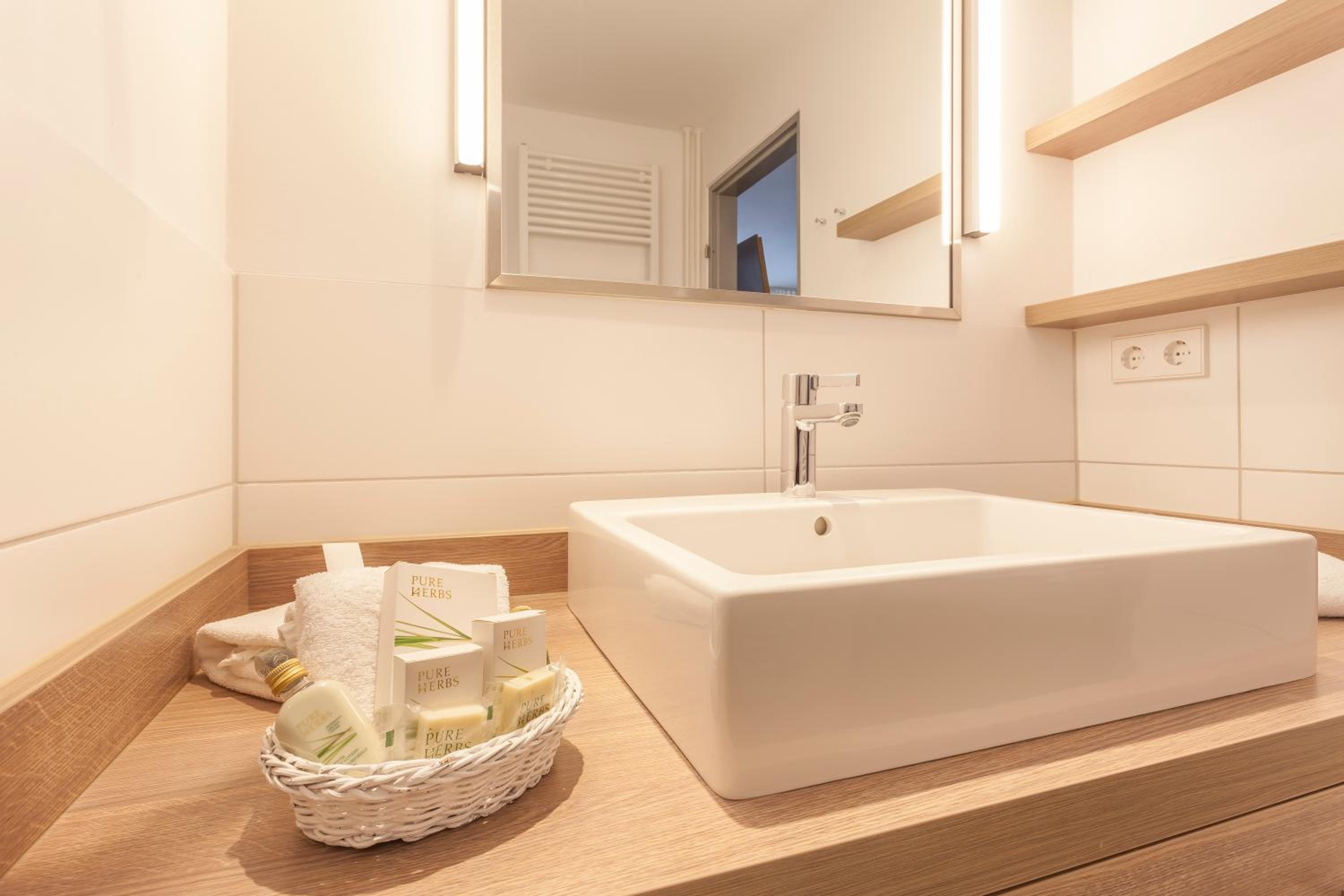 Suite with Balcony and Side View of the Sea