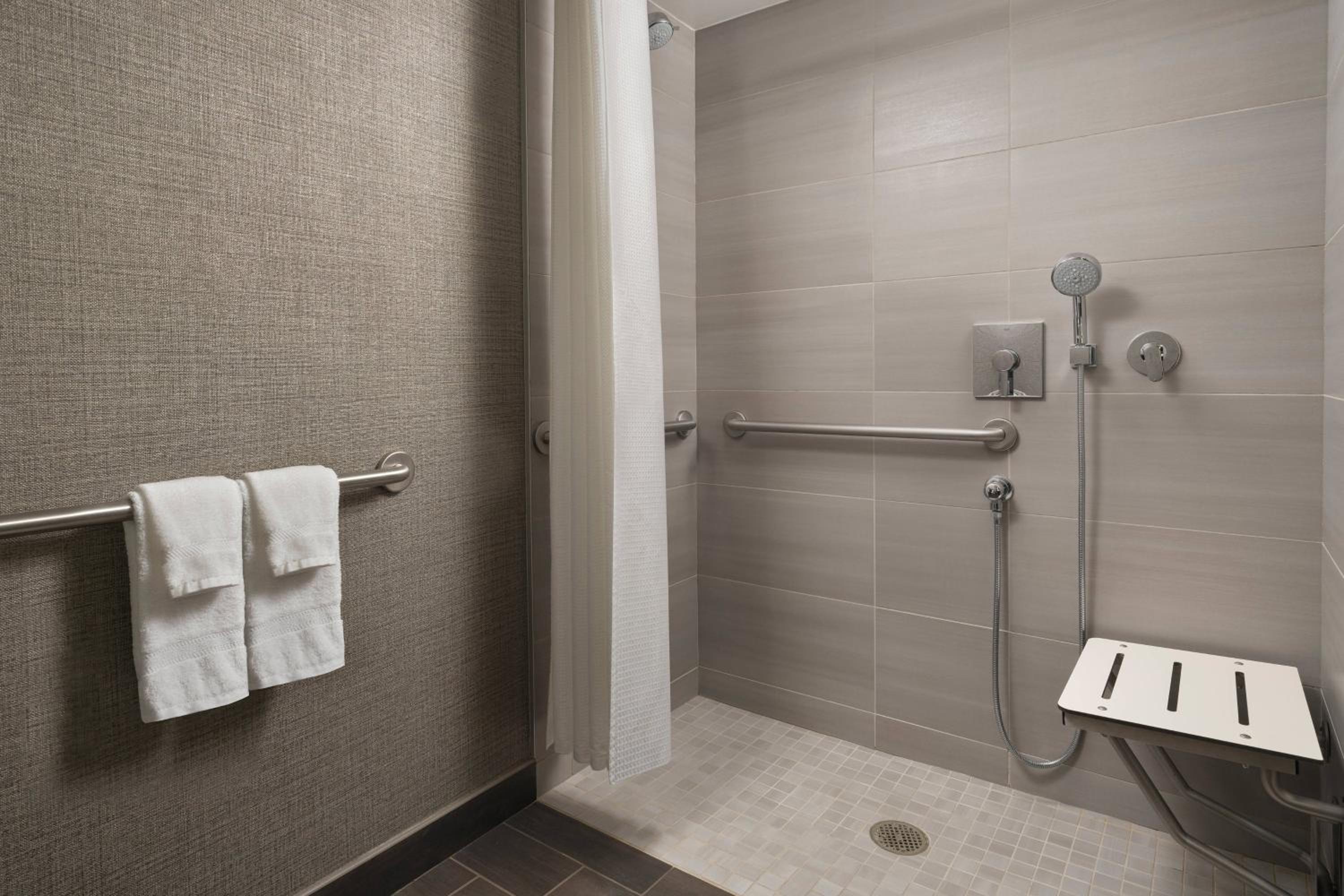 Ideal King Room with Balcony - Mobility Accessible with Roll-In Shower