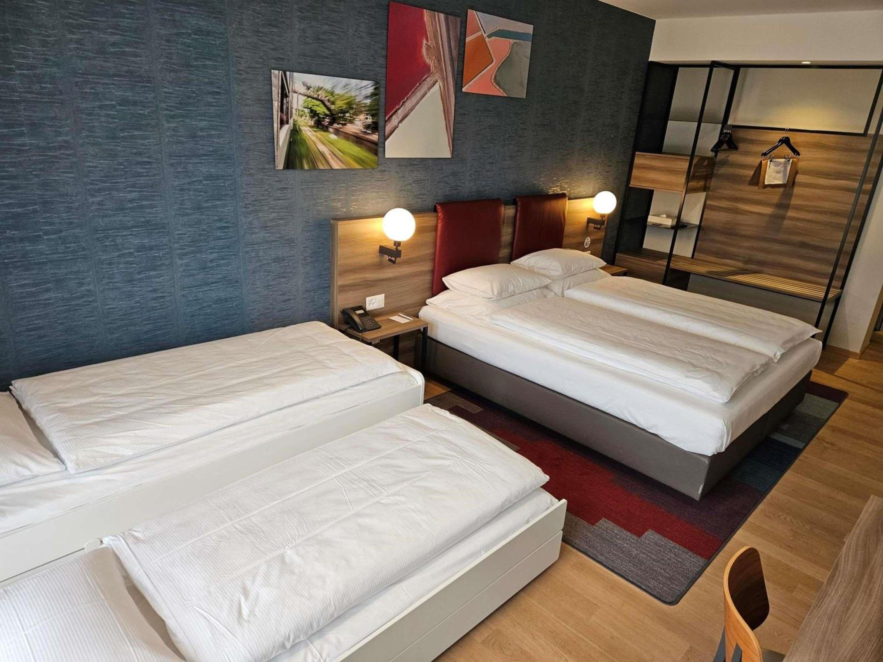 Family room with one double bed and one extra bed