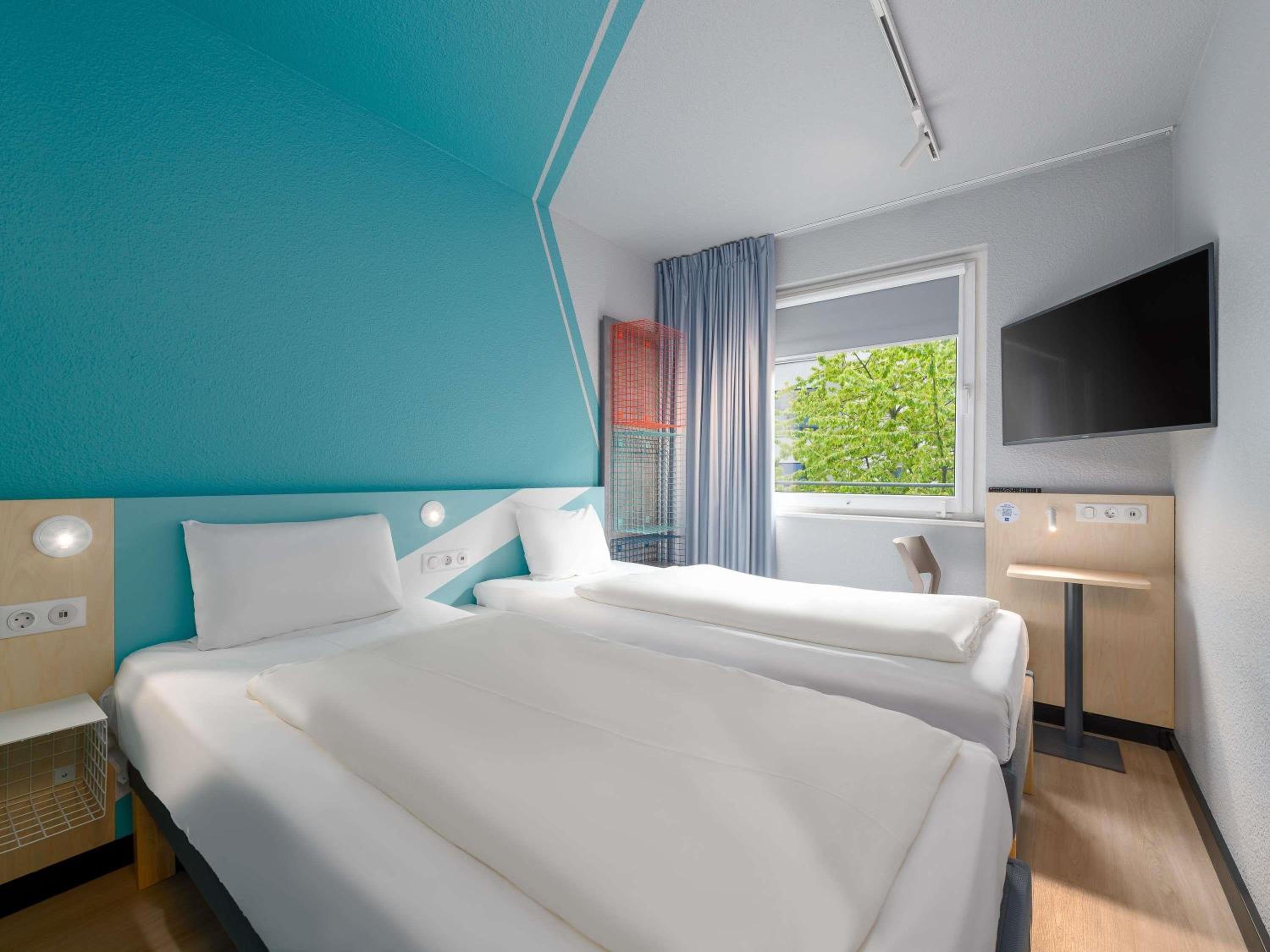 Small twin room with private bathroom and toilet