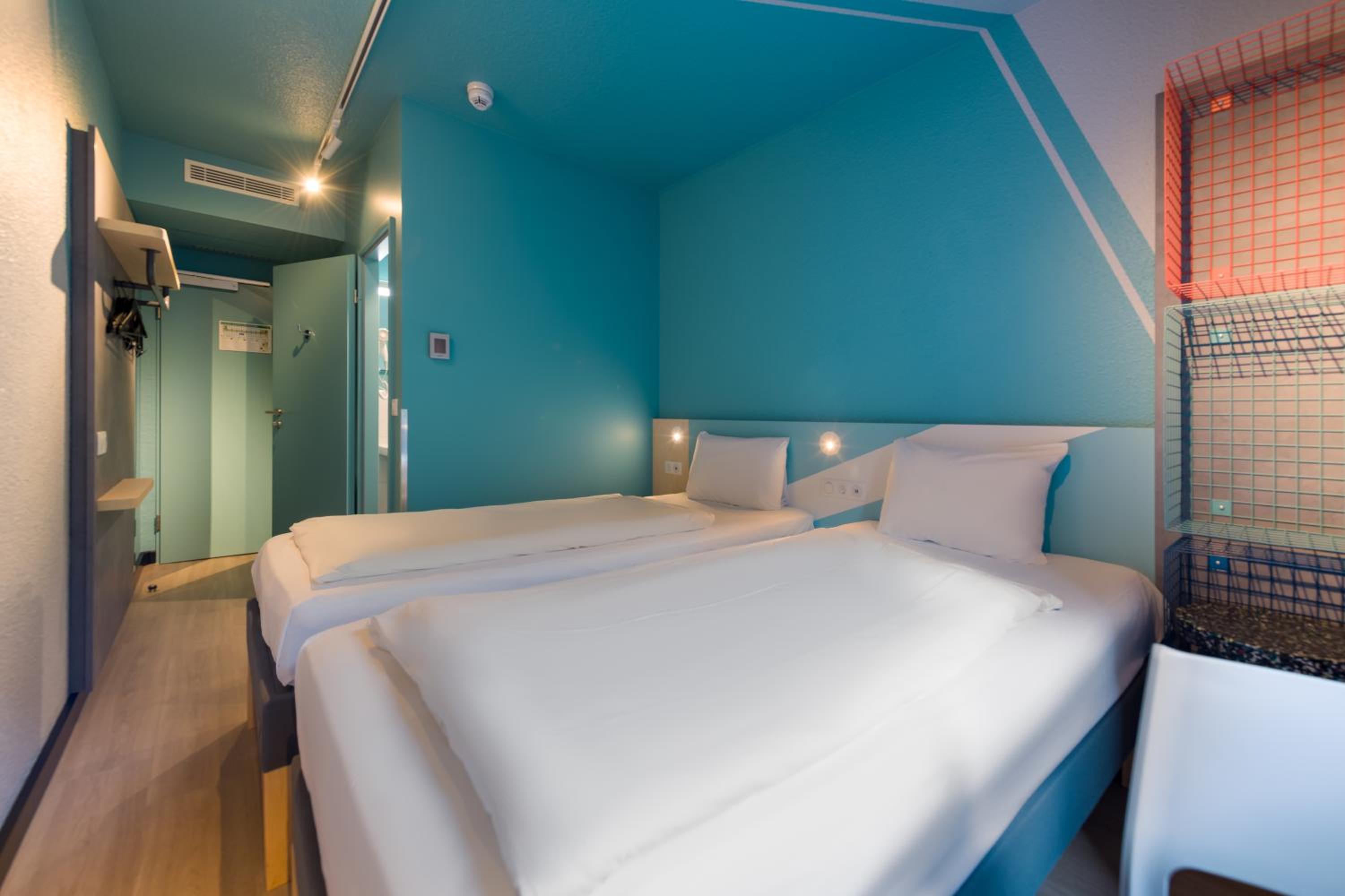 Small twin room with private bathroom and toilet