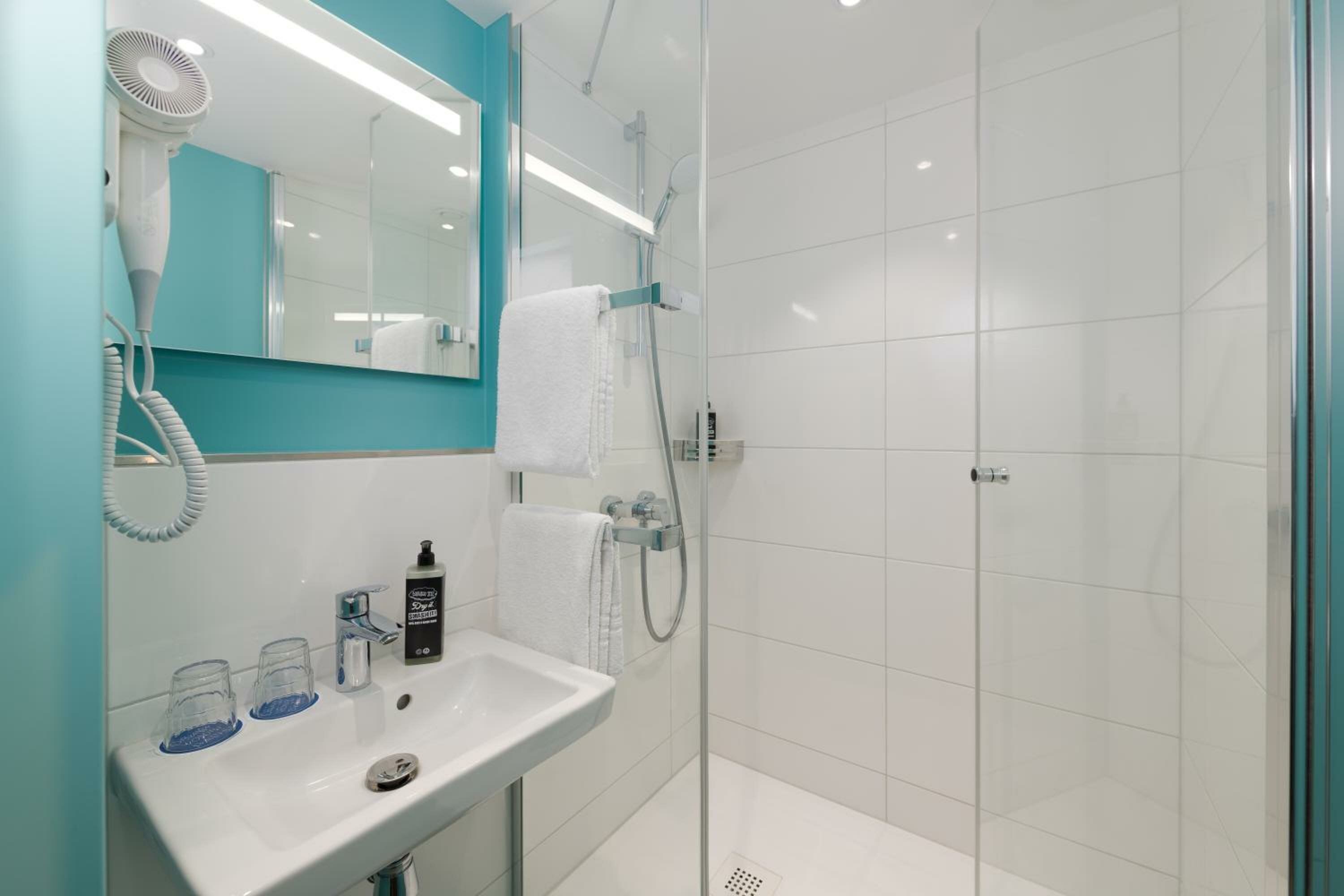 Small twin room with private bathroom and toilet