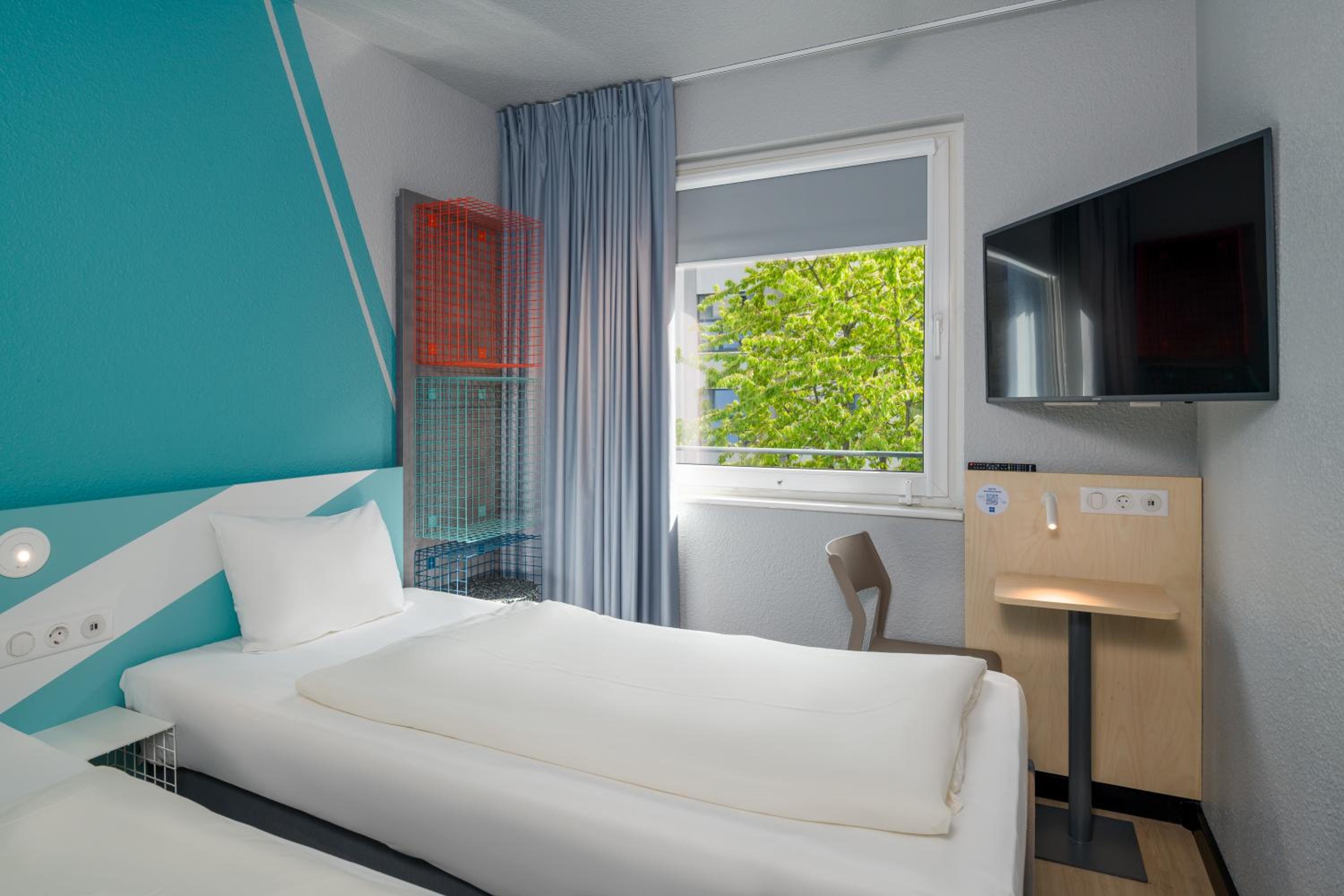 Small twin room with private bathroom and toilet