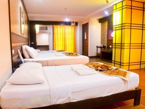 East Wing Premier Super Deluxe Room with Three Beds в La Carmela De Boracay Resort Hotel