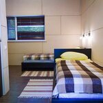 Небольшой двухместный номер с 2 отдельными кроватями в Лавола