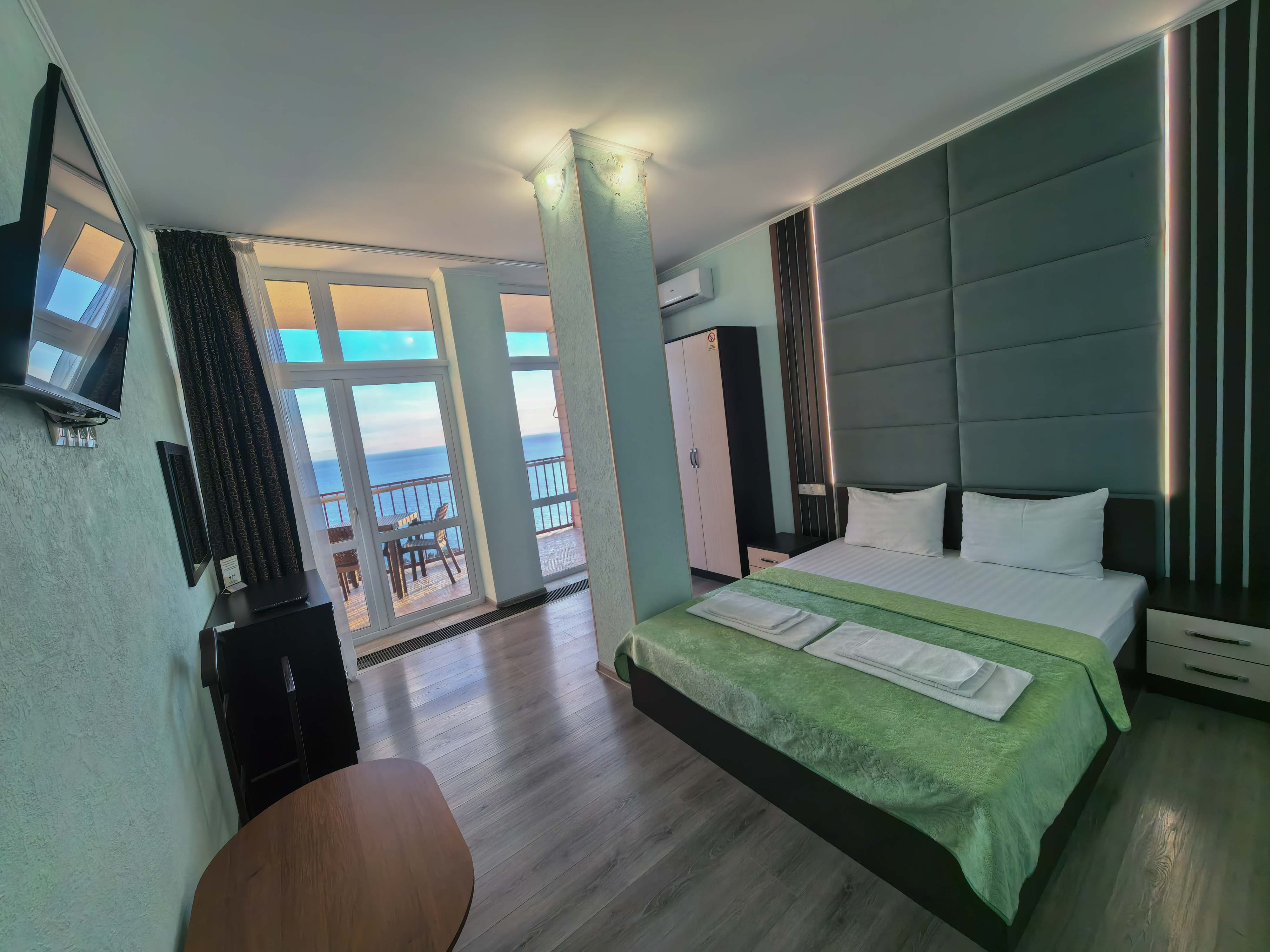 Двухместный однокомнатный люкс с кухней и видом на море