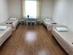 Кровать в общем номере с четырьмя кроватями в Парнас
