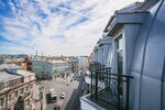 Улучшенный с балконом и видом на город с одной большой двуспальной кроватью в Cosmos St. Petersburg Nevsky Hotel
