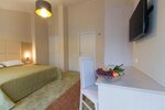 4 	Двухместный номер с двуспальной кроватью или c 2 односпальными кроватями и балконом в Невская Панорама