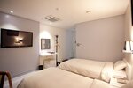 Двухместный номер «Делюкс» с 2 односпальными кроватями в Dong Seoul Hotel