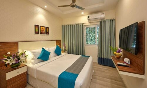 Deluxe Room (King Bed) в Regenta Inn Indiranagar