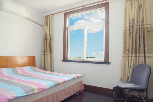 Двухместный номер с 1 двуспальной кроватью (Shared Bathroom ) в Xixili Disney 2nd Branch