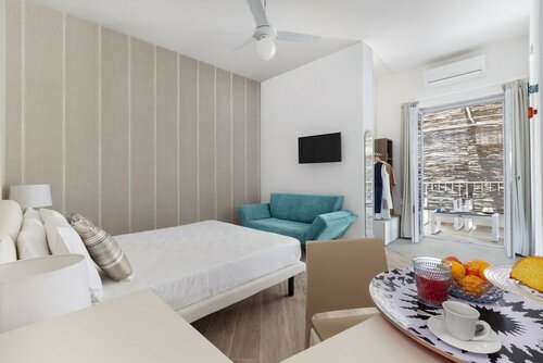 Номер «Классик», 1 спальня, отдельная ванная комната, частичный вид на море в Hotel Il Cefalo