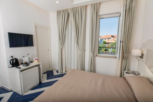 Стандартный двухместный номер с 1 двуспальной кроватью, вид на сад в Hotel Le Rocce