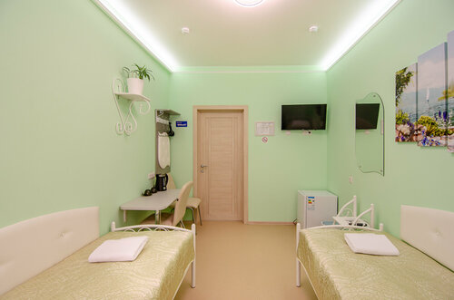 Двухместный номер с 2 отдельными кроватями и общим туалетом